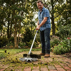 Aarenza Precision Grass Trimmer being used outdoors to trim grass edges, showcasing its lightweight design and ergonomic handle.