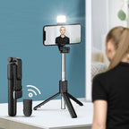 Arenzza 6-in-1 wireless Bluetooth selfie stick with extendable arm and built-in phone holder, perfect for selfies and group photos.