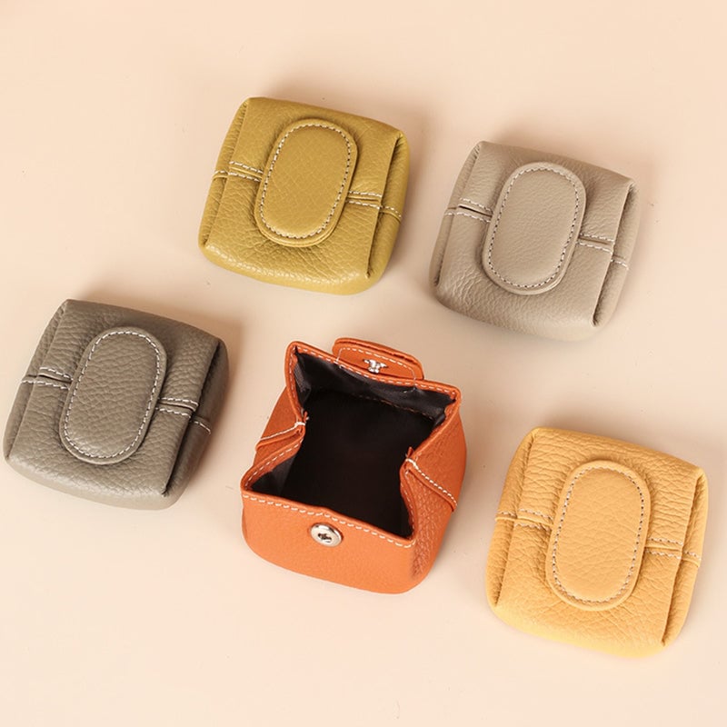 Arenzza solid color mini coin purse in various bright colors, featuring a compact, portable bag design with a zipper closure.