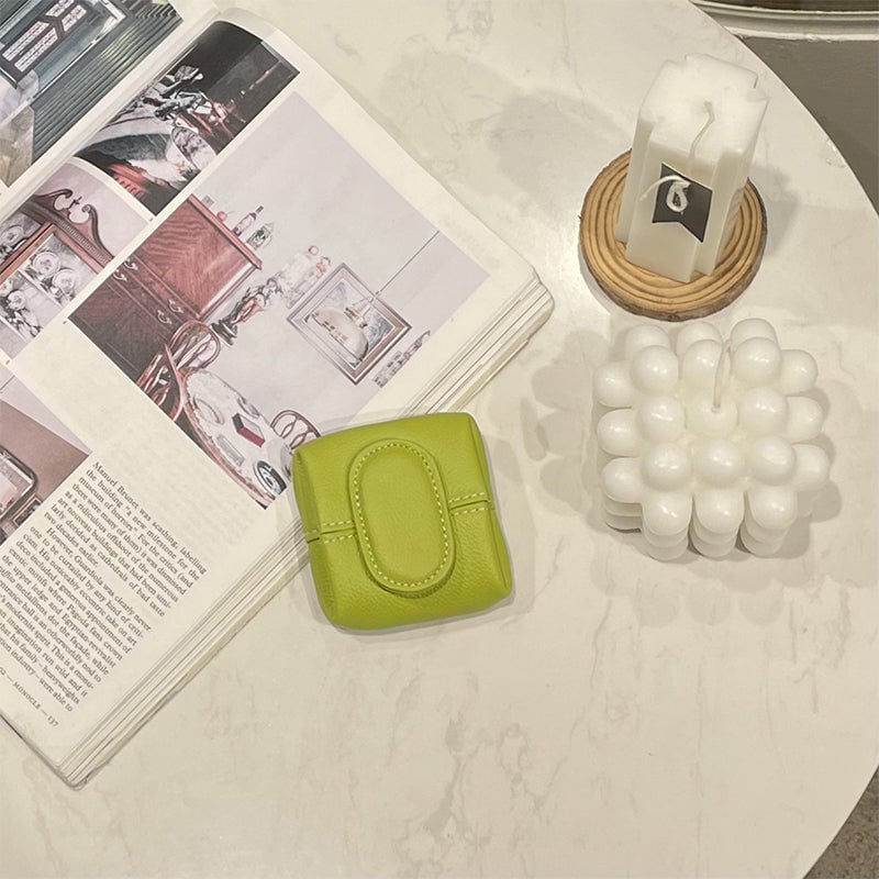 Arenzza mini coin purse in various solid colors, featuring a compact, portable bag design with a smooth finish and vibrant hues.