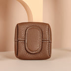 Arenzza mini coin purse in vibrant solid color, compact bag with a sleek design, perfect for carrying small essentials.