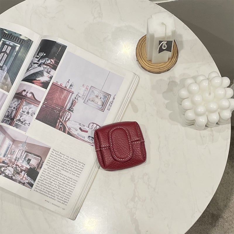Arenzza mini coin purse in various solid colors, small portable bag with a smooth, colorful fabric exterior and zipper closure.
