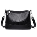 Aarenza crocodile print shoulder bag with a sleek design, featuring a structured shape and a stylish handle.