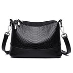 Aarenza crocodile print shoulder bag with a sleek design, featuring a structured shape and a stylish handle.