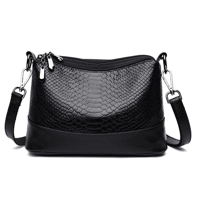 Aarenza crocodile print shoulder bag with a sleek design, featuring a structured shape and a stylish handle.
