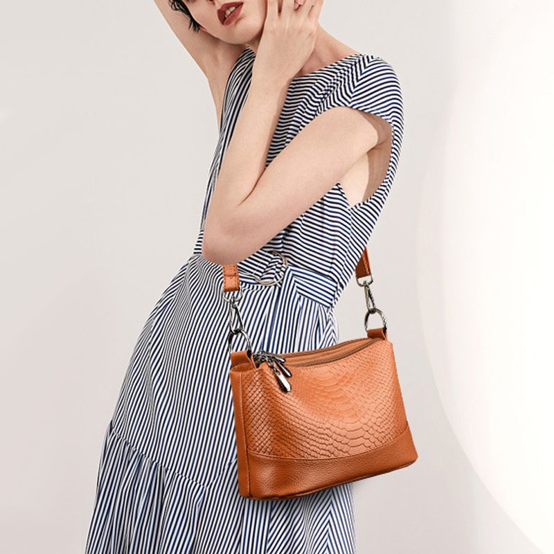 Aarenza crocodile print shoulder bag with stylish design, featuring a sleek shape and textured leather finish.