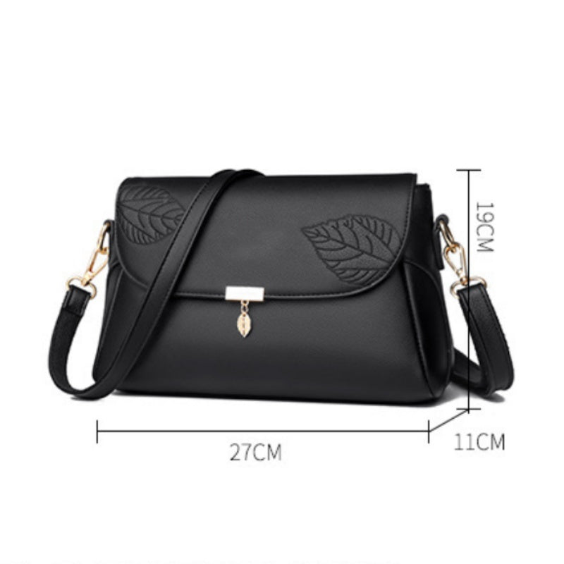 Aarenza multi-layer women's leather bag with multiple compartments and a sleek design, shown in a stylish, multi-tonal finish.