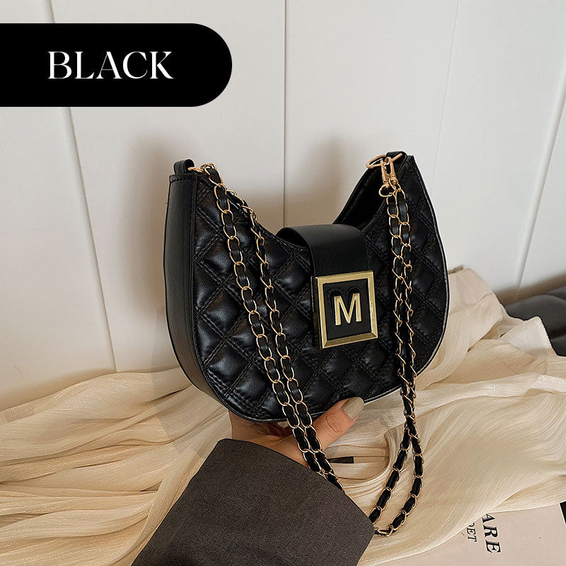 Women’s Quilted Dumpling Design Chain Crossbody Bag by Arenzza featuring a quilted pattern and chain strap.