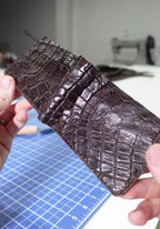 A handmade Arenzza genuine alligator pattern Mississippiensis leather wallet with a textured, luxurious design and classic style.