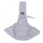 Arenzza dog sling carrier bag holding a small dog, with adjustable straps and soft fabric for comfortable pet transport.