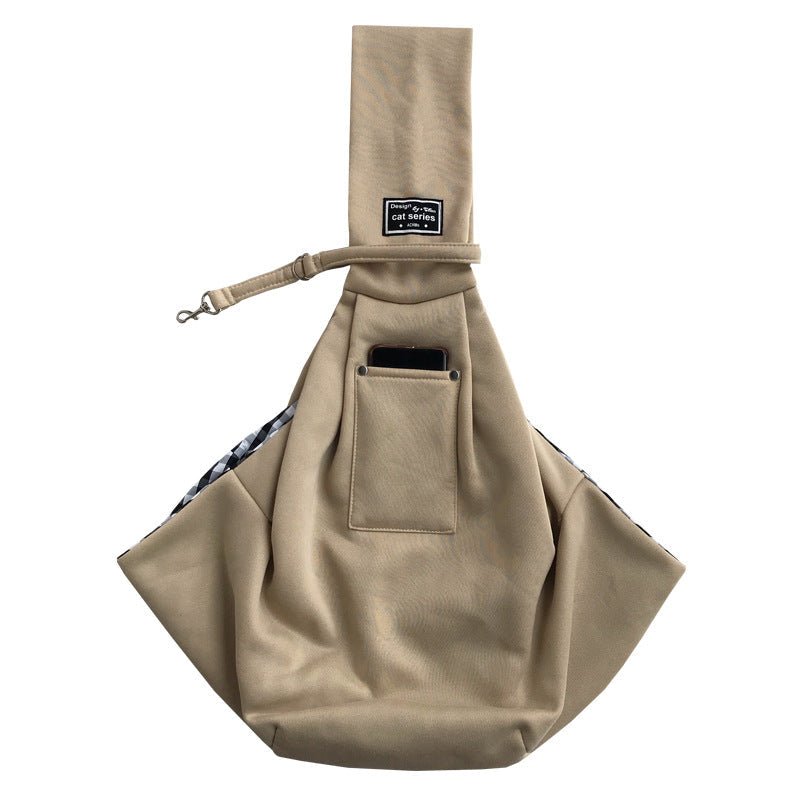 Aarenza dog sling carrier bag with adjustable strap holding a small dog inside for comfortable carrying.