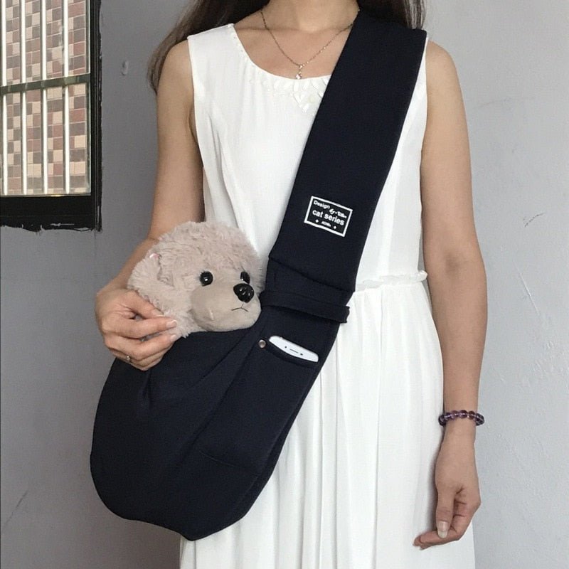 Arenzza dog sling carrier bag with adjustable strap, soft fabric interior, designed for comfortable pet carrying.