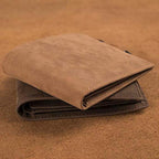 Aarenza engraved genuine leather wallet, stylish men's bag with detailed engraving, in rich brown leather on a plain background.