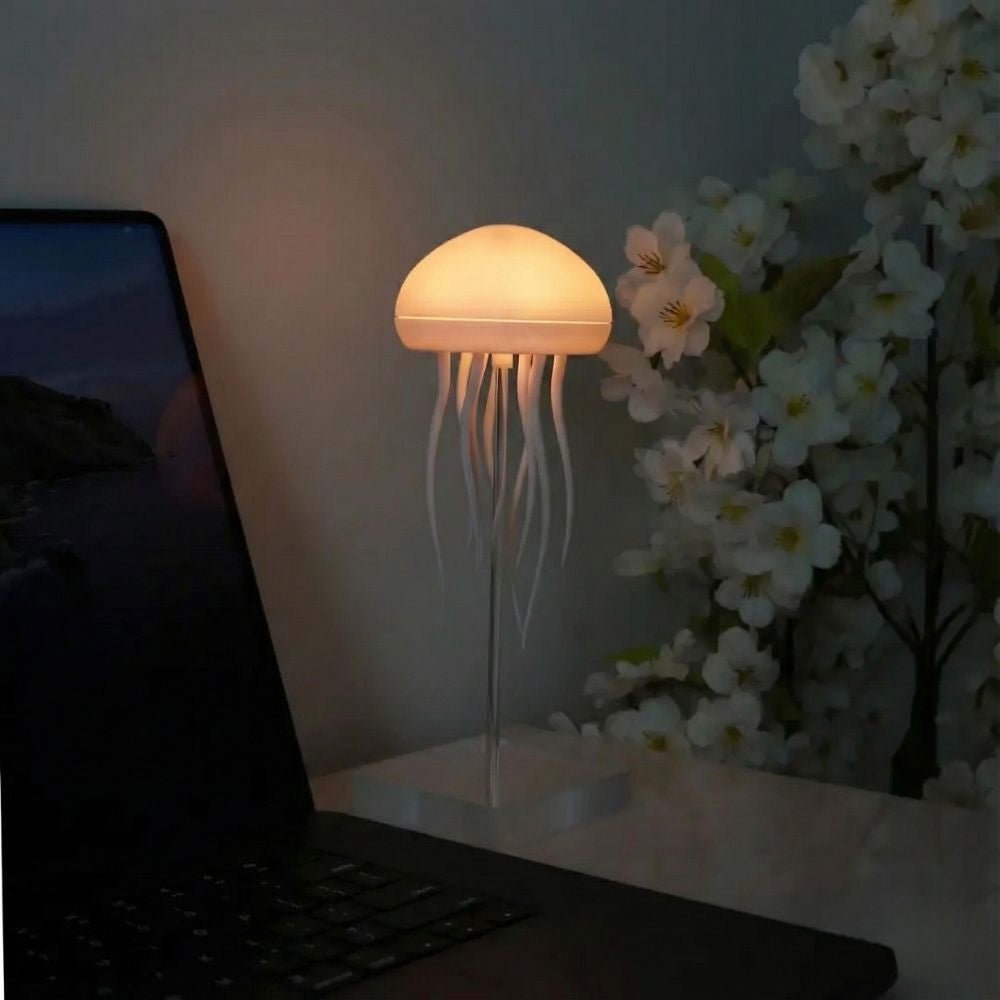 Aarenzza JellyFlow™ Rechargeable Floating Jellyfish Lamp with realistic jellyfish design floating in water, illuminated with soft LED light.
