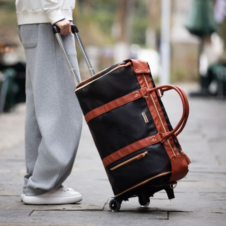 Aarenza EasyCarry™ ultra-capacious travel bag with wrinkle-free design, shown filled with clothes and travel essentials.