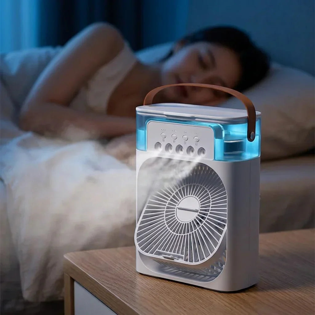 A person using the AquaBreeze™ Compact Desk Air Cooler by Arenzza on a workspace, showing the portable cooling device on a desk.