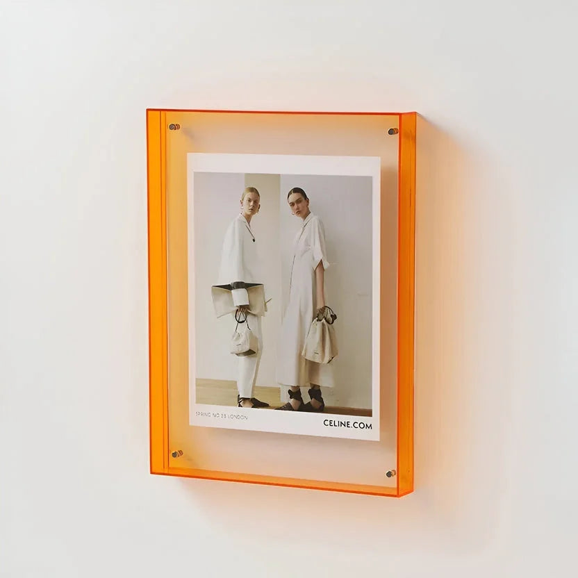 Clear acrylic picture frame by Arenzza, minimalist wall-mounted frame showcasing a photo with sleek, transparent design.