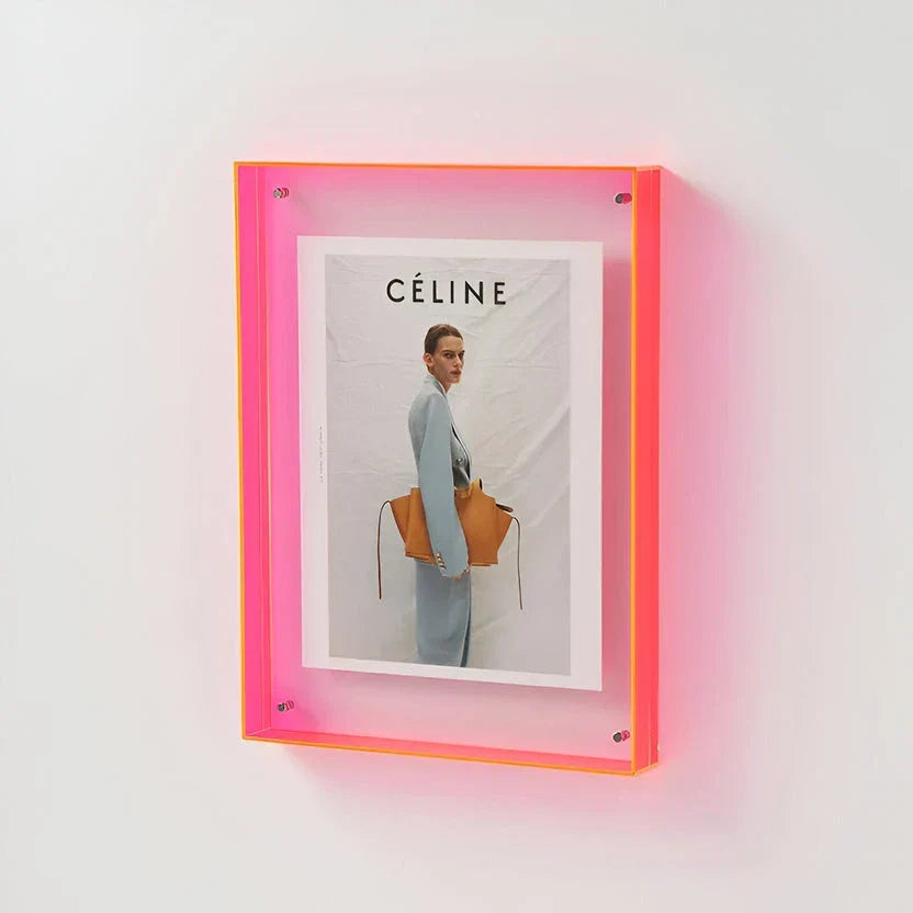 A clear acrylic wall picture frame by Arenzza, showcasing a minimalist design for displaying photographs or artwork.