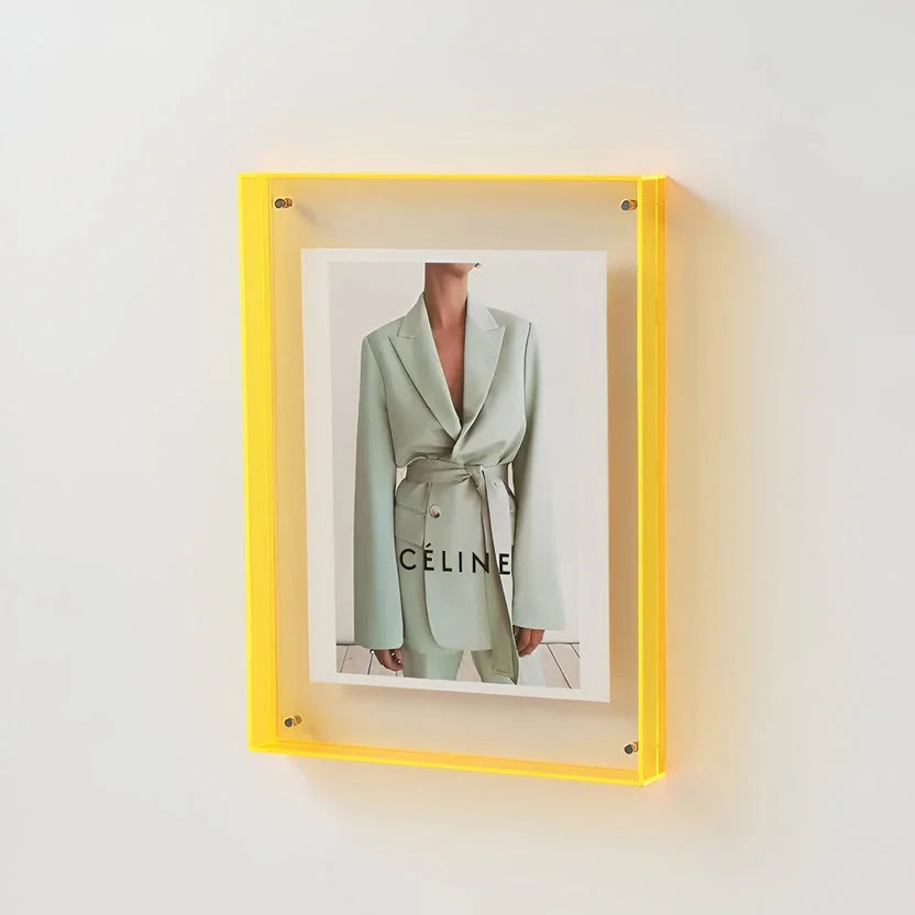Clear acrylic picture frame by Arenzza, minimalist wall-mounted design, showcasing a modern and sleek display for photos or artwork.