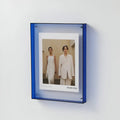 Clear acrylic picture frame by Arenzza, minimalist wall-mounted photo display with sleek transparent design.