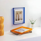 Acrylic picture frame by Arenzza, minimalist wall-mounted design with clear, transparent material for displaying photos.