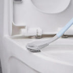Arenzza silicone toilet brush with a sleek handle and cleaning head for sparkling clean toilets, shown in a bathroom setting.