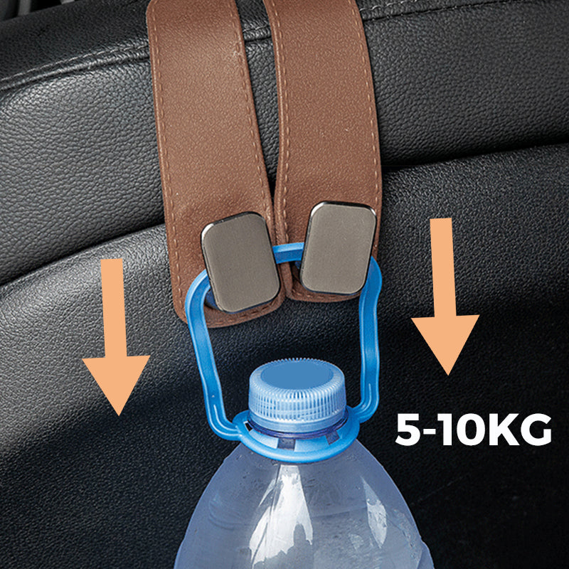 Arenzza durable car seat headrest hook storage organizer attached to a car headrest, holding bags and personal items.