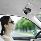 Arenzza car sunglasses storage box in a sleek black design, shown inside a vehicle with sunglasses stored inside.