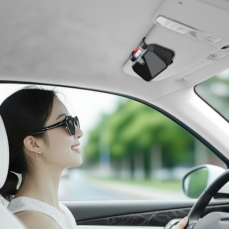 Arenzza car sunglasses storage box in a sleek black design, shown inside a vehicle with sunglasses stored inside.