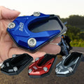 Arenzza motorcycle kickstand foot extension pad attached to a bike's side stand for added stability and support.