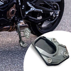 Arenzza motorcycle kickstand foot side stand extension attached to a motorcycle, providing additional support and stability.