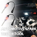 Arenzza automotive spark plug coil ignition tester showing a close-up of the device used for testing car ignition coils and spark plugs.