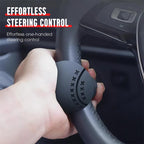 Arenzza steering wheel booster knob for effortless car steering, shown attached to a vehicle's steering wheel.