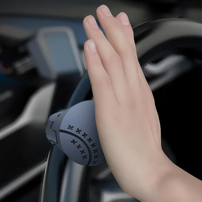 Arenzza steering wheel booster knob installed on a car steering wheel, making driving easier and more comfortable.