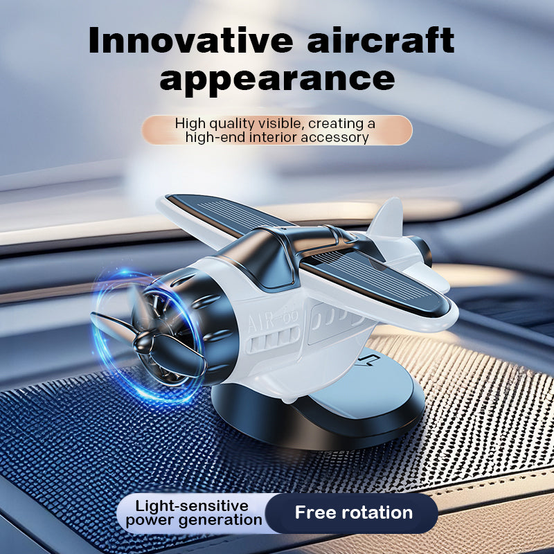Arenzza solar-powered airplane-shaped car ornament attached to a vehicle's dashboard or window.