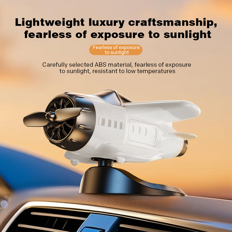 Solar powered airplane-shaped car ornament by Arenzza, a decorative car accessory with a sleek airplane design.