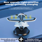 Arenzza solar-powered airplane-shaped car ornament attached to a vehicle's dashboard or window.