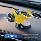 Solar powered airplane-shaped car ornament by Arenzza, decorative car accessory featuring a sleek airplane design.