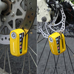 Arenzza motorcycle anti-theft alarm disc lock with key, mounted on a motorcycle brake disc for security protection.