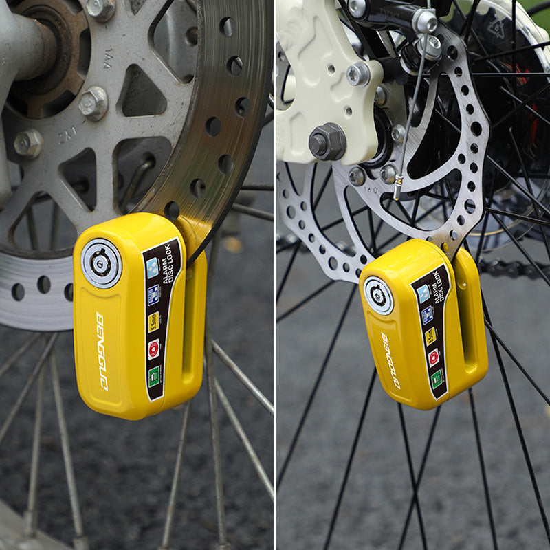 Arenzza motorcycle anti-theft alarm disc lock with key, mounted on a motorcycle brake disc for security protection.