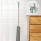 Arenzza multifunction retractable microfiber dust brush and gap mop for cleaning tight spaces and surfaces, shown in use.