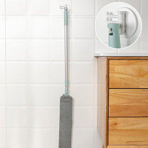 Arenzza multifunction retractable microfiber dust brush and gap mop for cleaning tight spaces and surfaces, shown in use.
