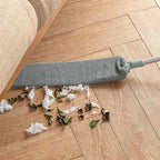 Arenzza multifunction retractable microfiber dust brush and gap mop for cleaning tight spaces and surfaces, shown in use.
