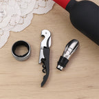 Arenzza wine opener set for wine lovers, including corkscrew and accessories, displayed on a wooden surface.