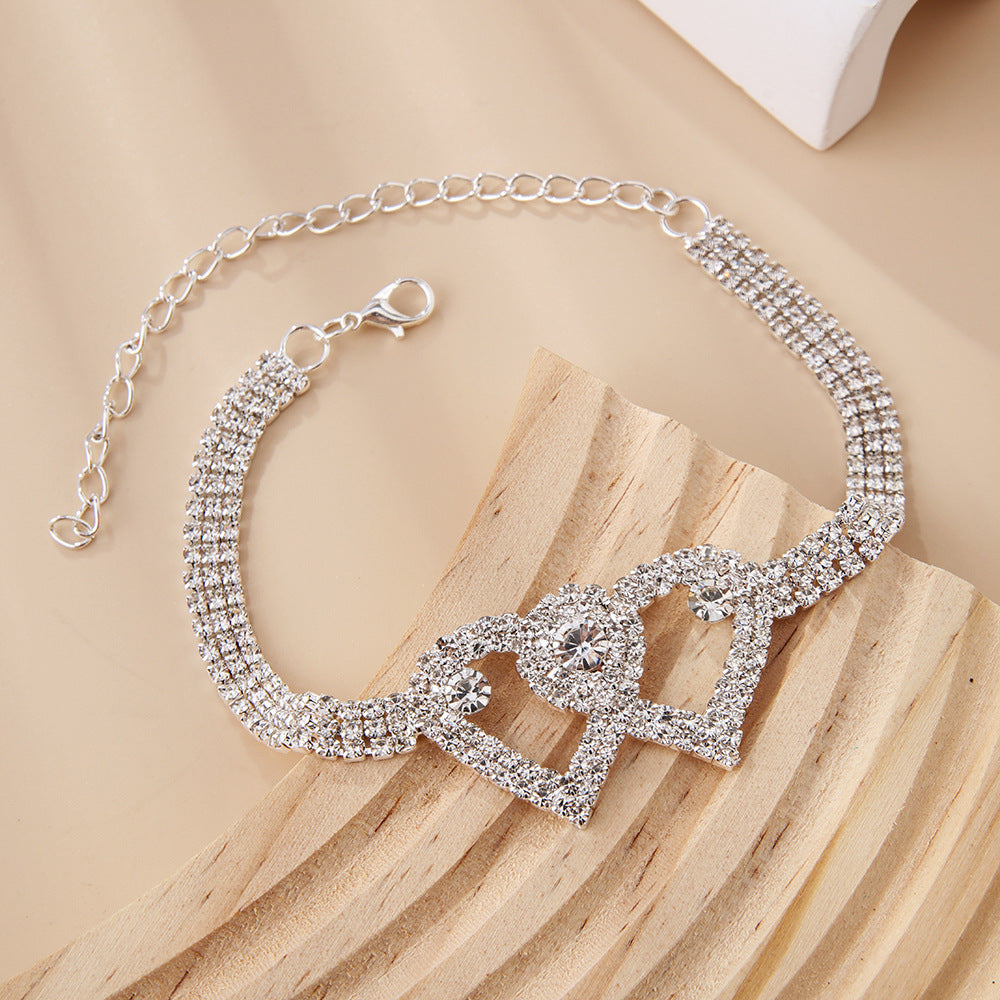 Arenzza Heart X Heart ankle bracelet with delicate silver chain and heart charms, perfect for stylish summer accessories.