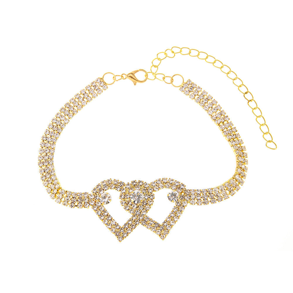 Arenzza Heart X Heart ankle bracelet with silver chain and heart charms, displayed on a white background.