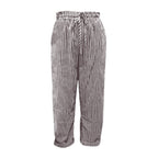 A woman wearing striped linen and cotton trousers from Arenzza, showcasing effortless style and comfortable fit.