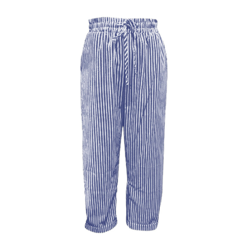 A woman wearing striped linen cotton trousers from Arenzza, showcasing effortless style and comfort in a casual outfit.