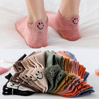 A pair of Arenzza 4 Seasons cartoon embroidered socks featuring smiling face designs in vibrant colors.