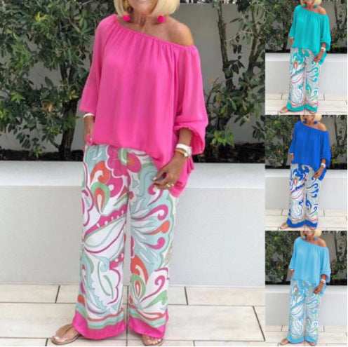 A woman wearing Arenzza women's trousers and off-shoulder top 2-piece set, casual fashion outfit on a white background.